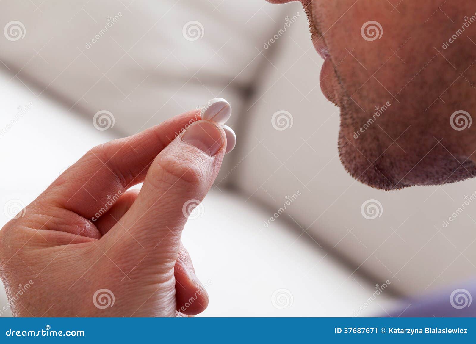 man taking a pill