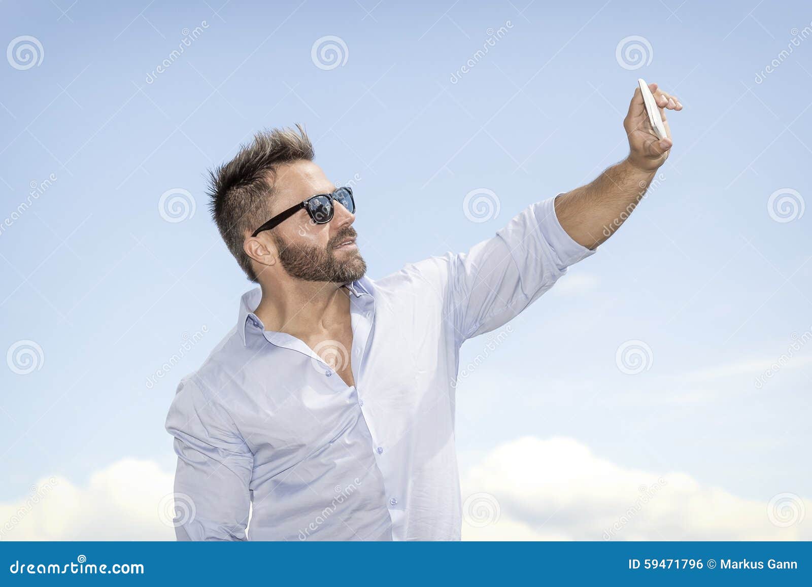 Man taking selfie. An image of a man taking a selfie with his smart phone