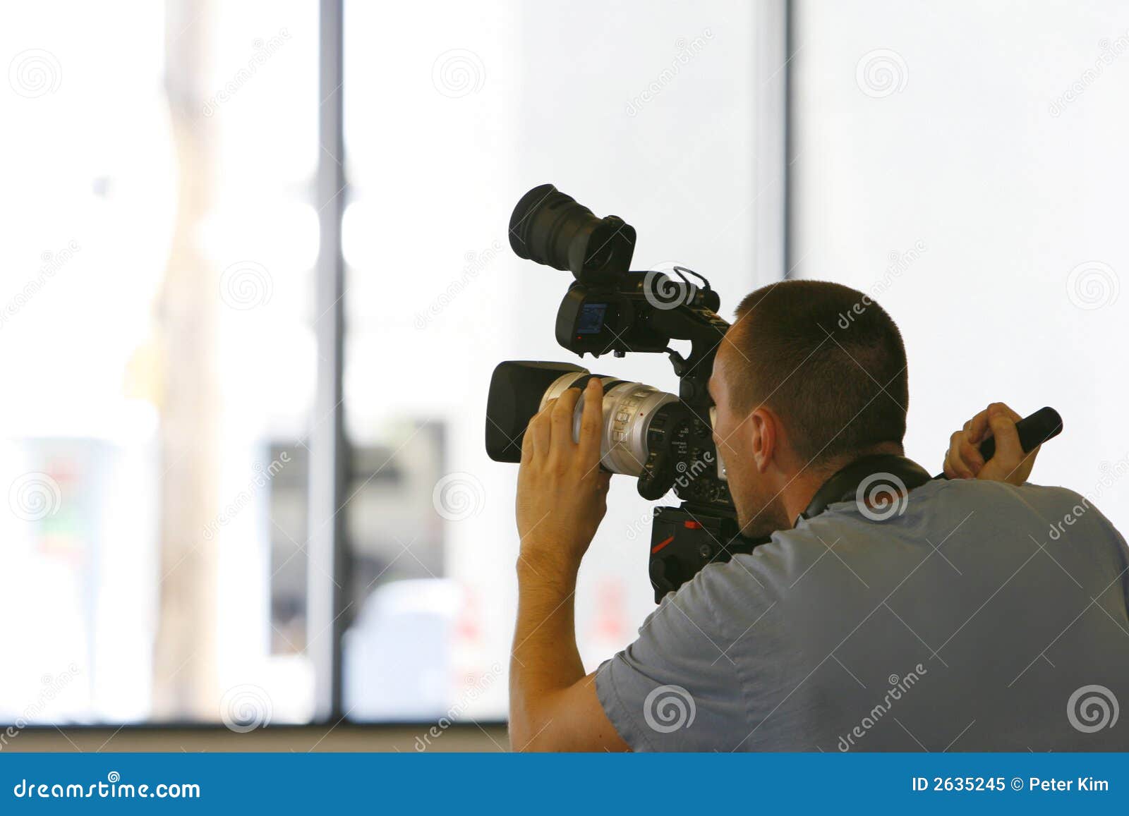 Man Taping with Video Camera Stock Image Image of production, film