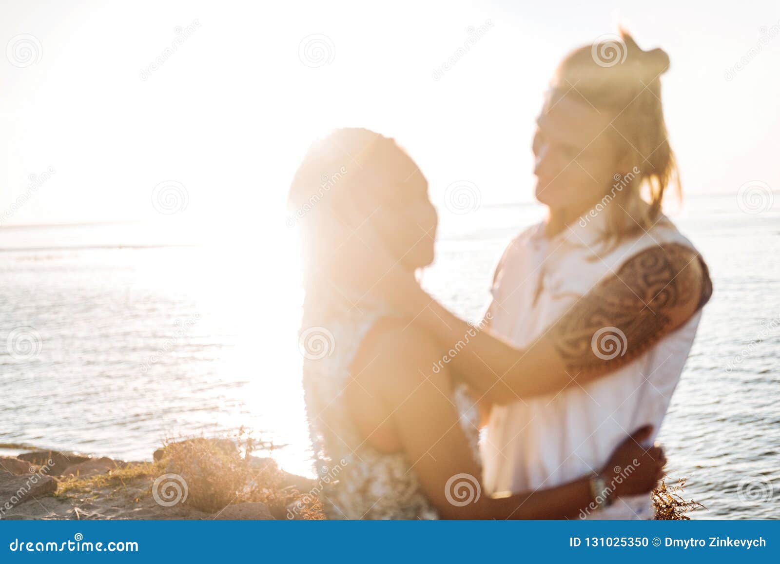 Man with Tattoo Hugging His Girlfriend Watching the Sunset at the Seaside Stock Photo - Image of feeling, athletes: 131025350 Man with Tattoo Hugging His Girlfriend Watching the Sunset at the Seaside Stock Photo - Image of feeling, athletes: 131025350
