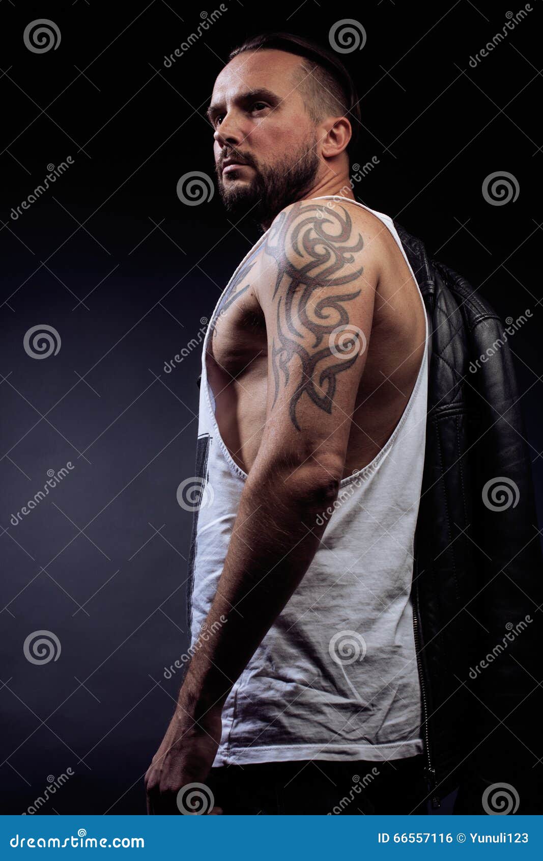 A Man With Tattooes On His Arms Silhouette Of Muscular Body