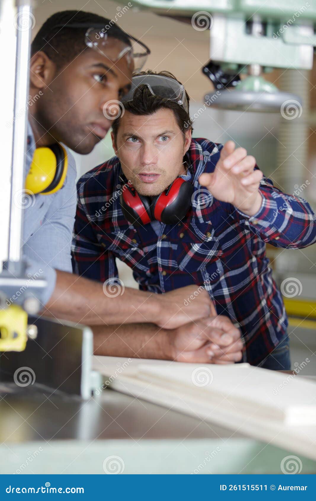 Man Teaching Apprentice How To Cut Wood Stock Image Image of training