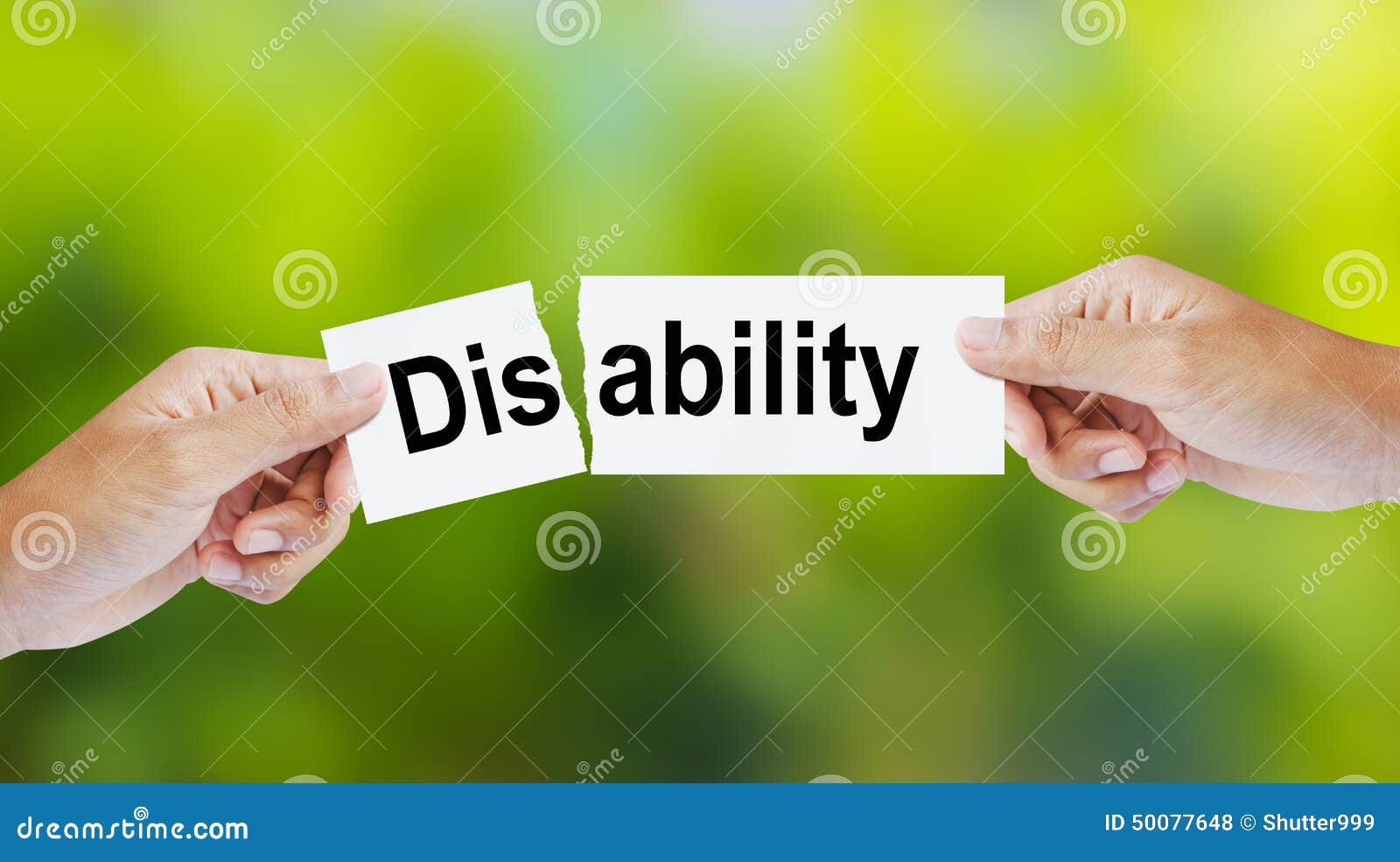 man tearing the word disability for ability