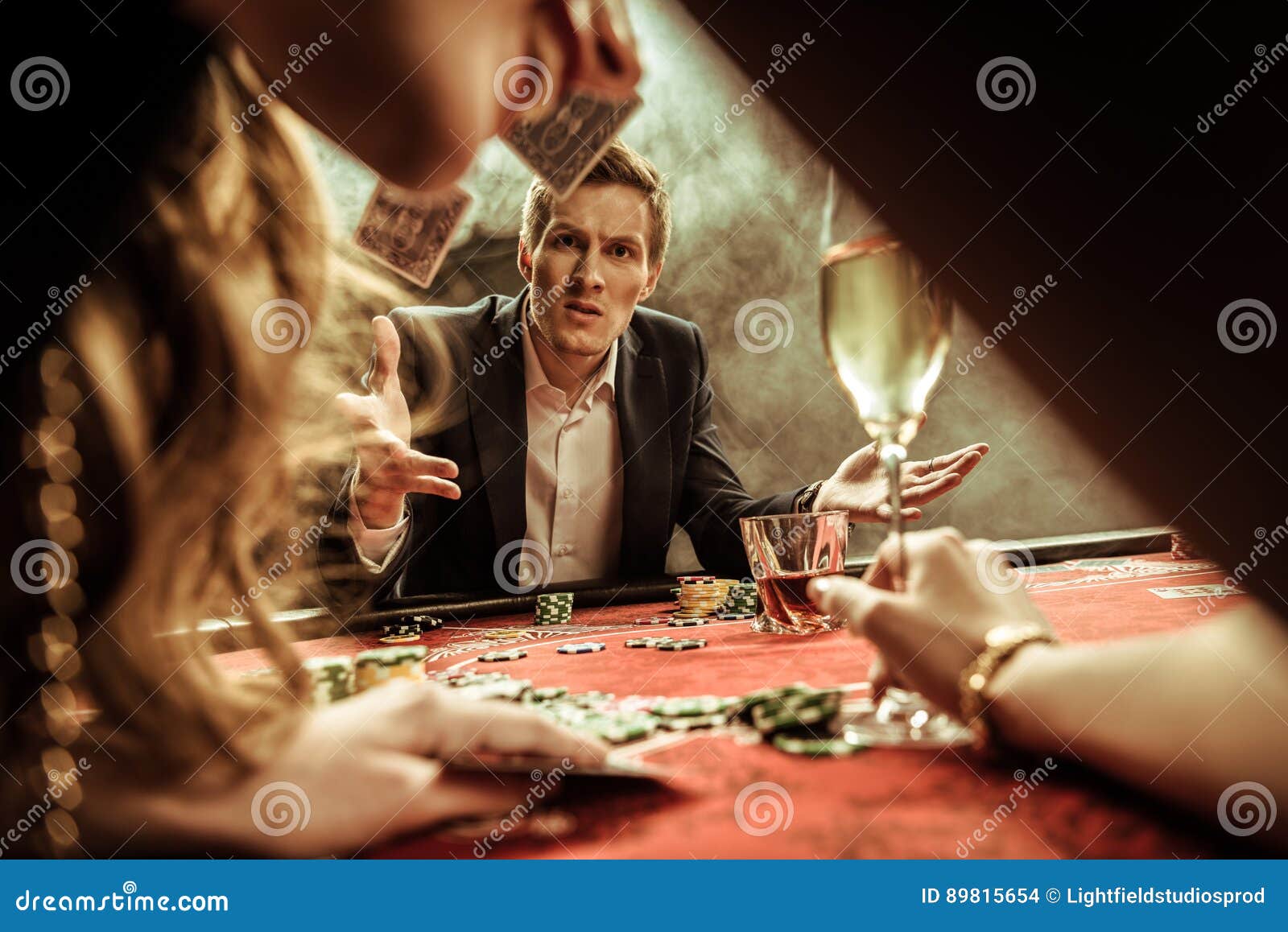 Man Throwing Cards while Playing Poker Stock Photo Image of together