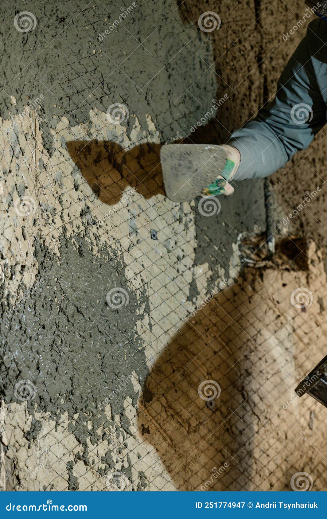 A Man Throws Concrete Mortar on the Wall, the First Layer of Plaster on
