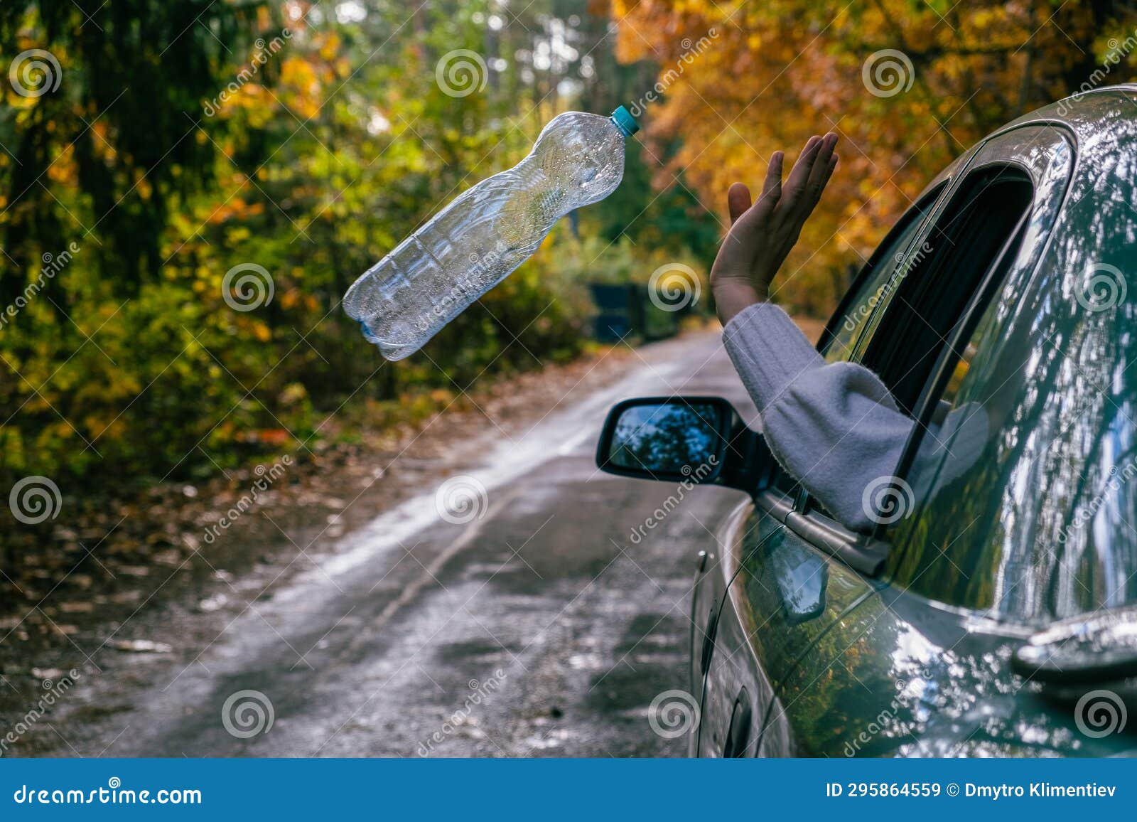 A Man Throws an Empty Plastic Bottle Out of a Car. Stock Image Image