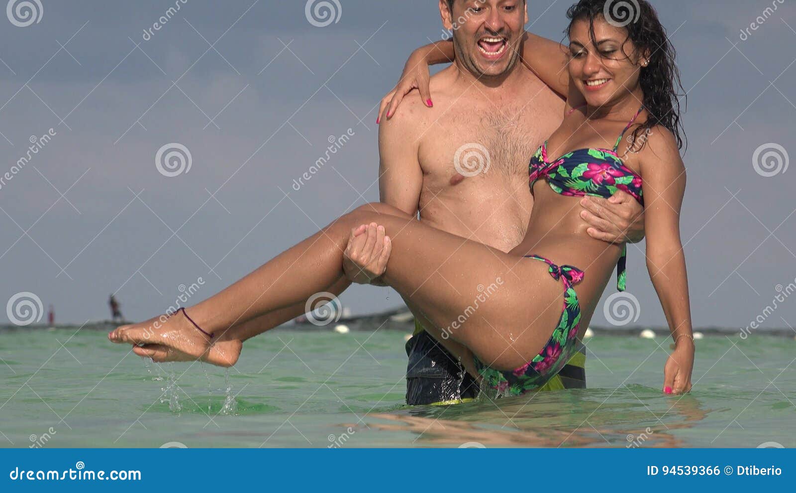 Man Throws Woman into Water and Splashing Stock Footage