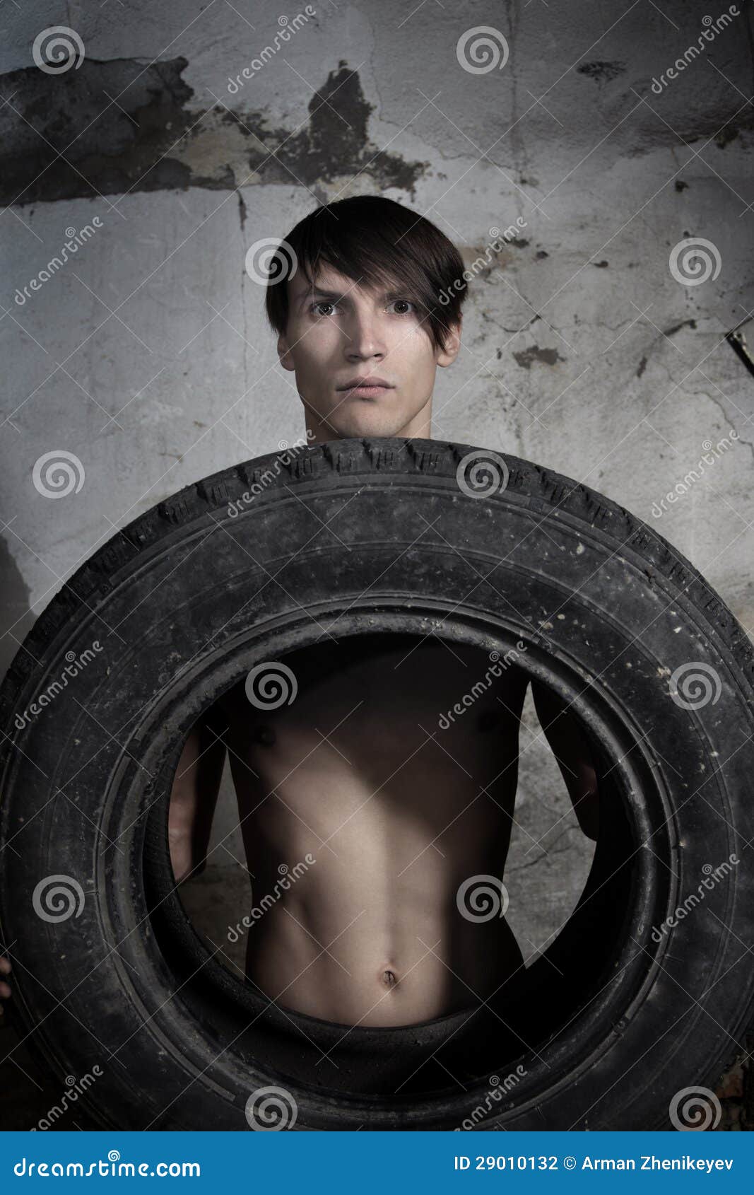 Man with tire stock photo. Image of shadow, body, single 29010132