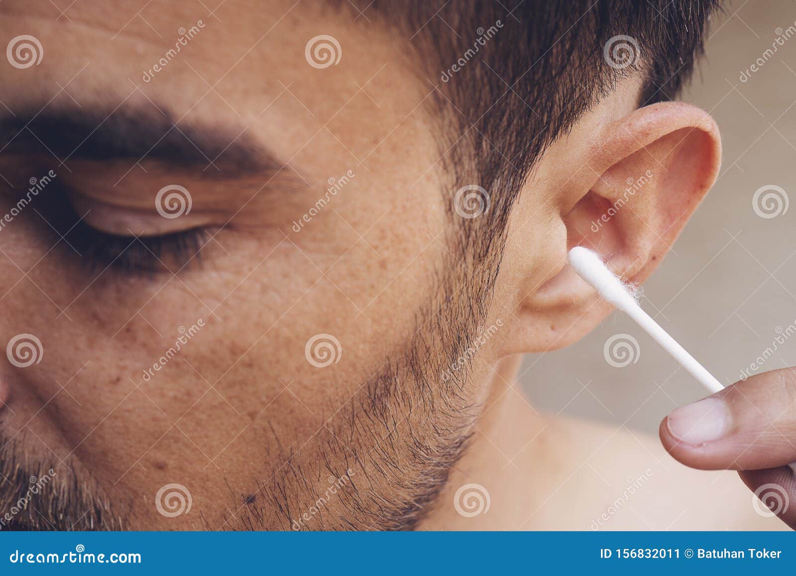 Man about To Clean His Ears Using Qtip Cotton Swab. Hygiene Essentials