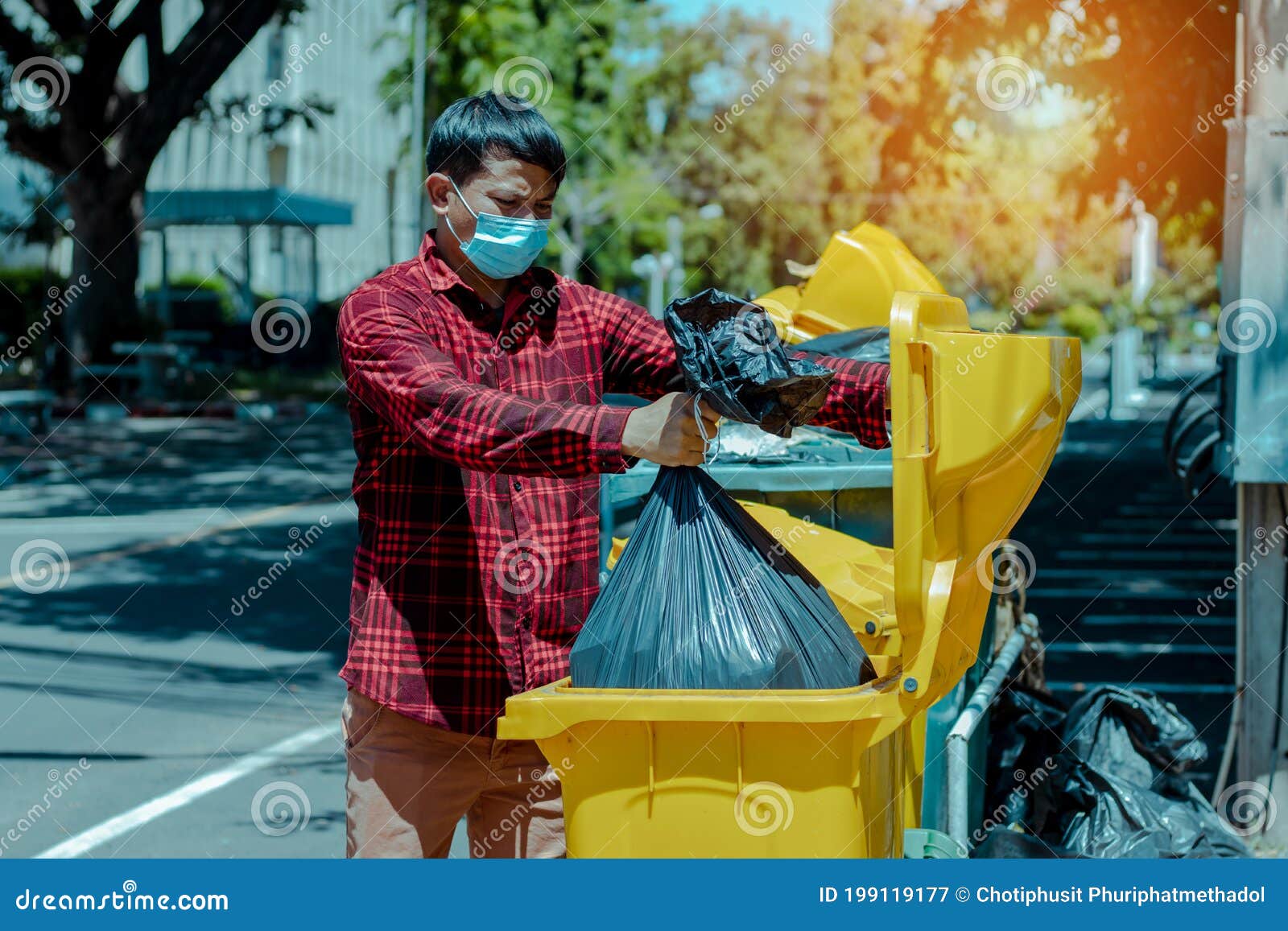 The Man Took the Black Bag To Throw Away the Garbage Stock Image