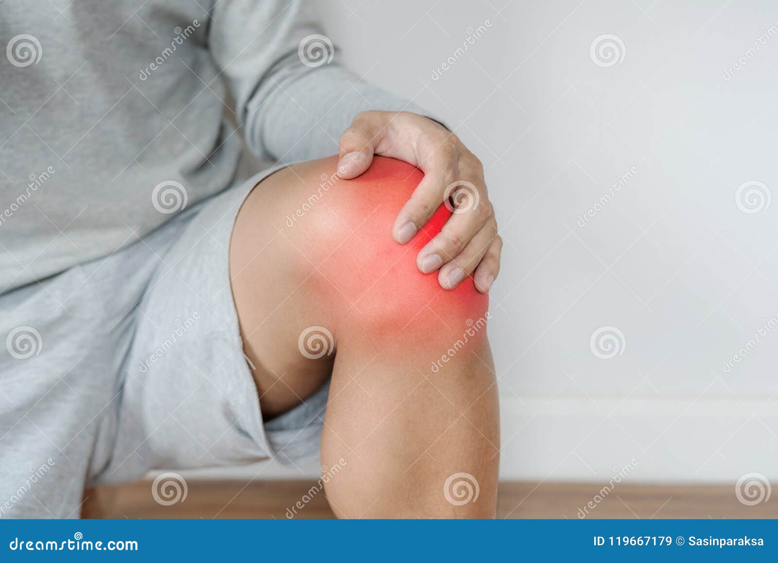 a man touching knee with red highlights concept of knee and joint pain