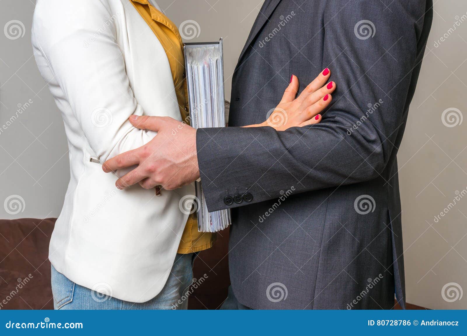 Man Touching Woman`s Elbow - Sexual Harassment in Office Stock Photo