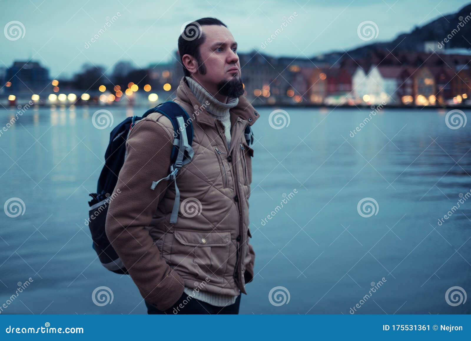 man tourist against tyskebryggen in bergen, norway