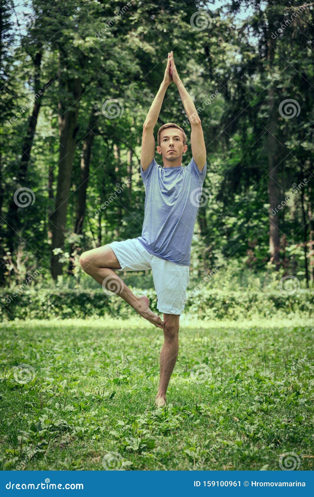 Man Training Yoga in Tree Pose in Park Stock Image - Image of training ...