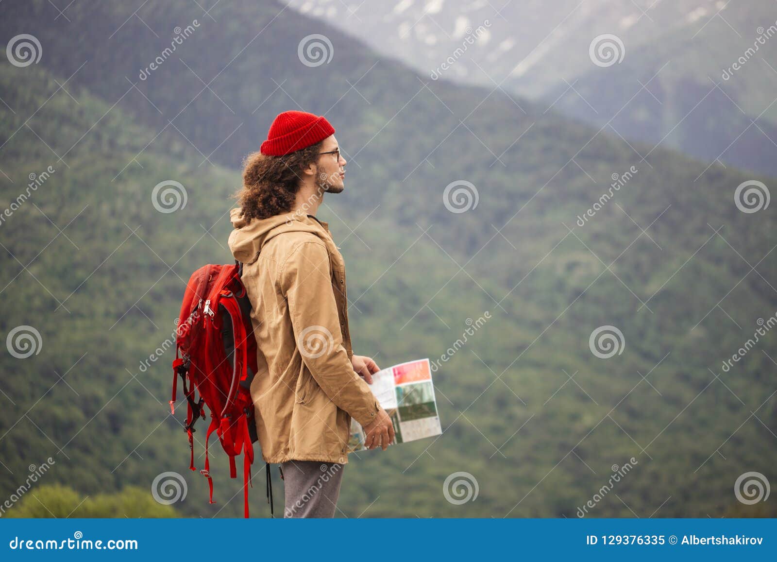 Man Traveler With Map And Red Backpack Searching Location Outdoor With Rocky Mountains On Background Stock Image Image Of Nature Landscape