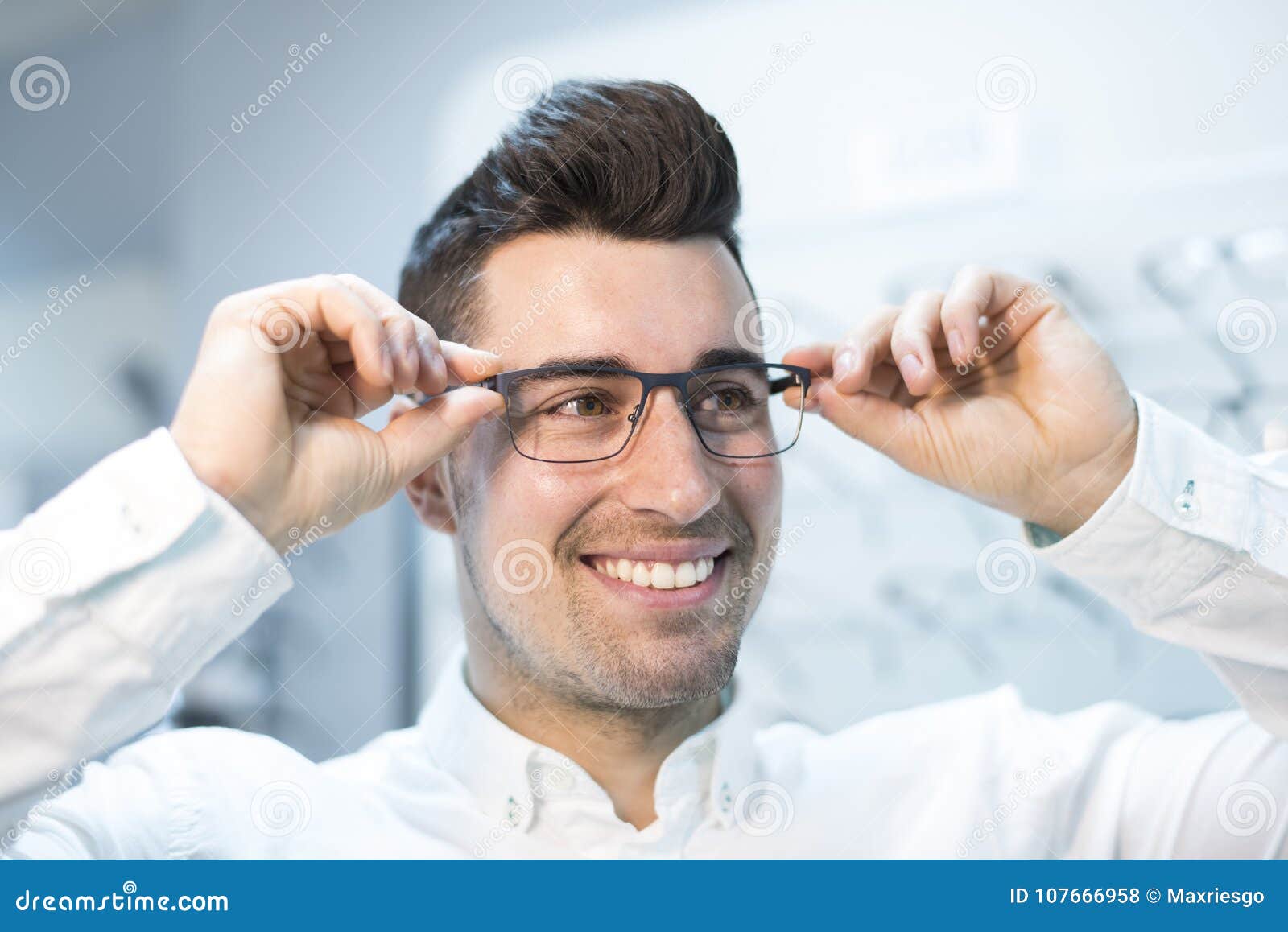 Man Trying on Glasses in Optical Store Stock Photo - Image of glasses ...