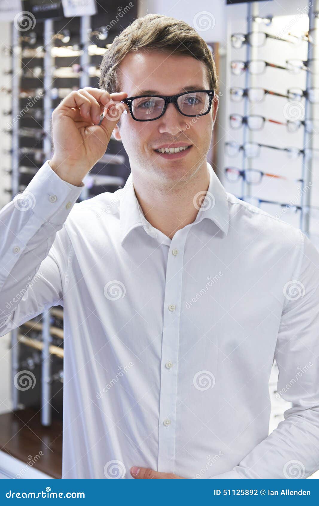 Man Trying on New Glasses at Opticians Stock Photo - Image of male ...