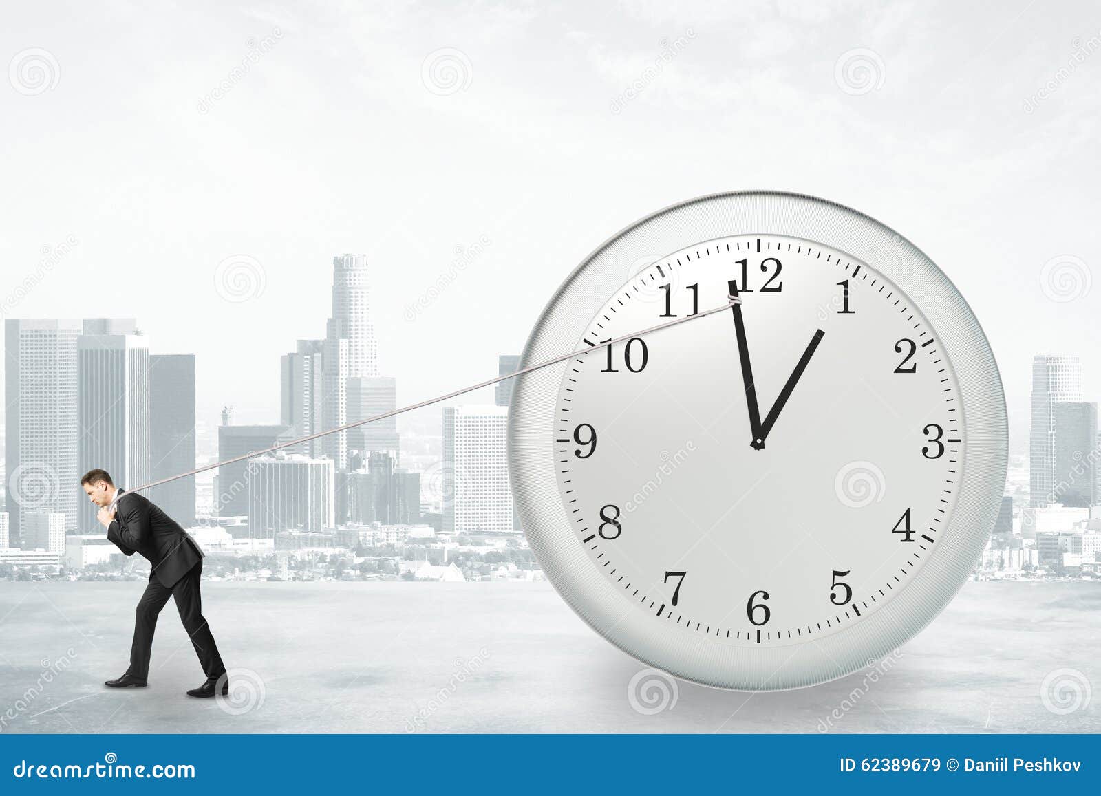 Businessman trying to stop time Stock Photo by ©kantver 69891211