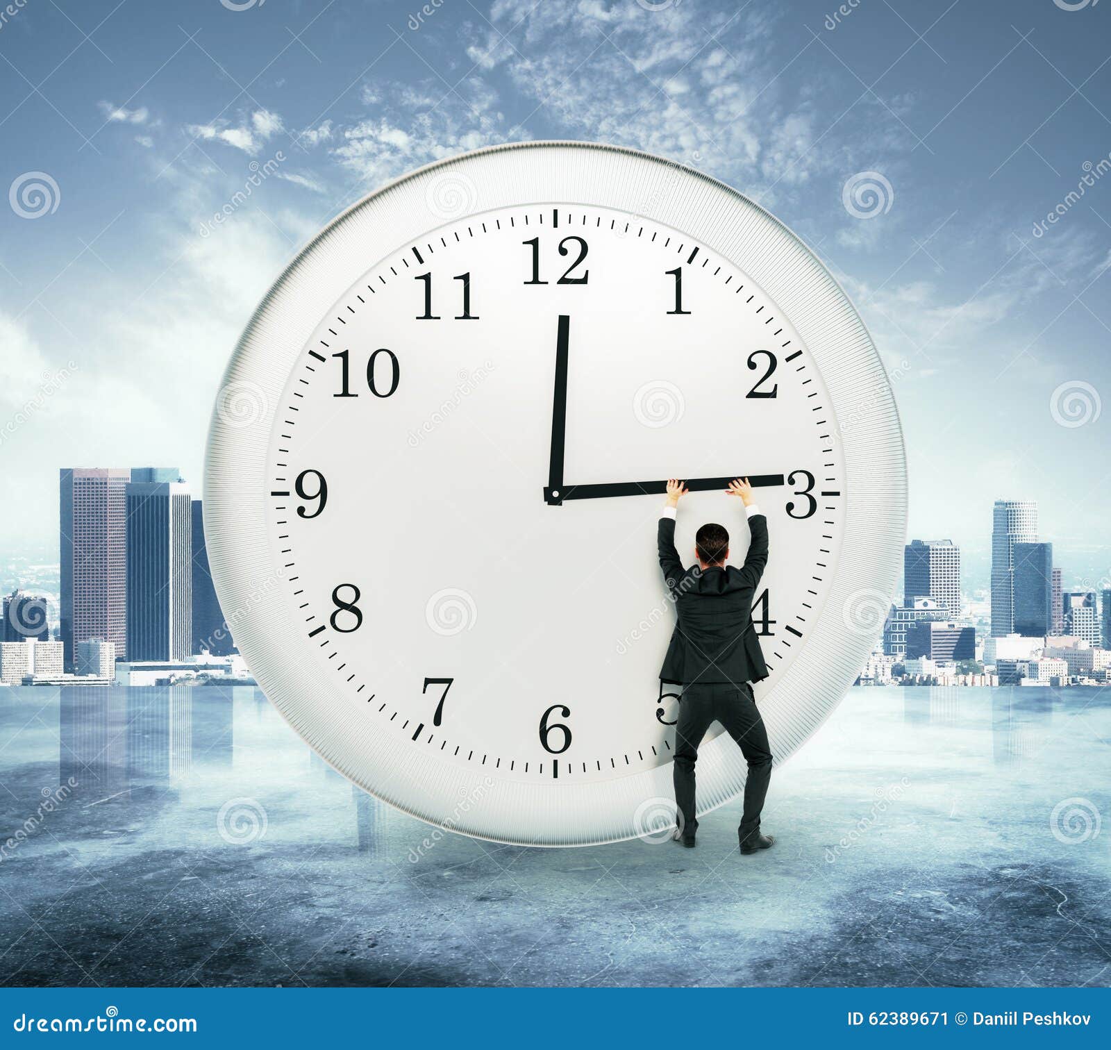 Businessman trying to stop time Stock Photo by ©kantver 69891211