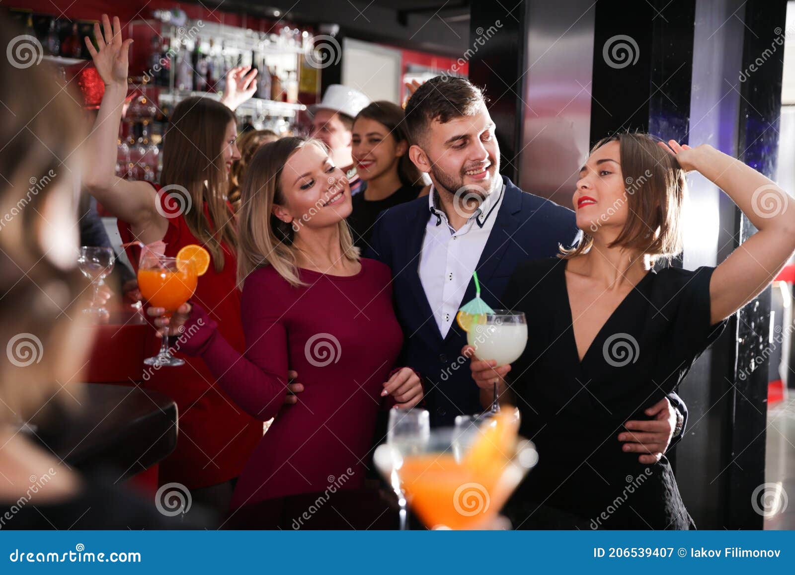 Man and Two Women at Nightclub Stock Image - Image of clubbing, cliques ...
