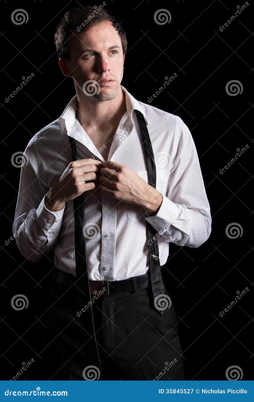 Man Unbuttoning His Shirt stock image. Image of unbuttoned - 35845527