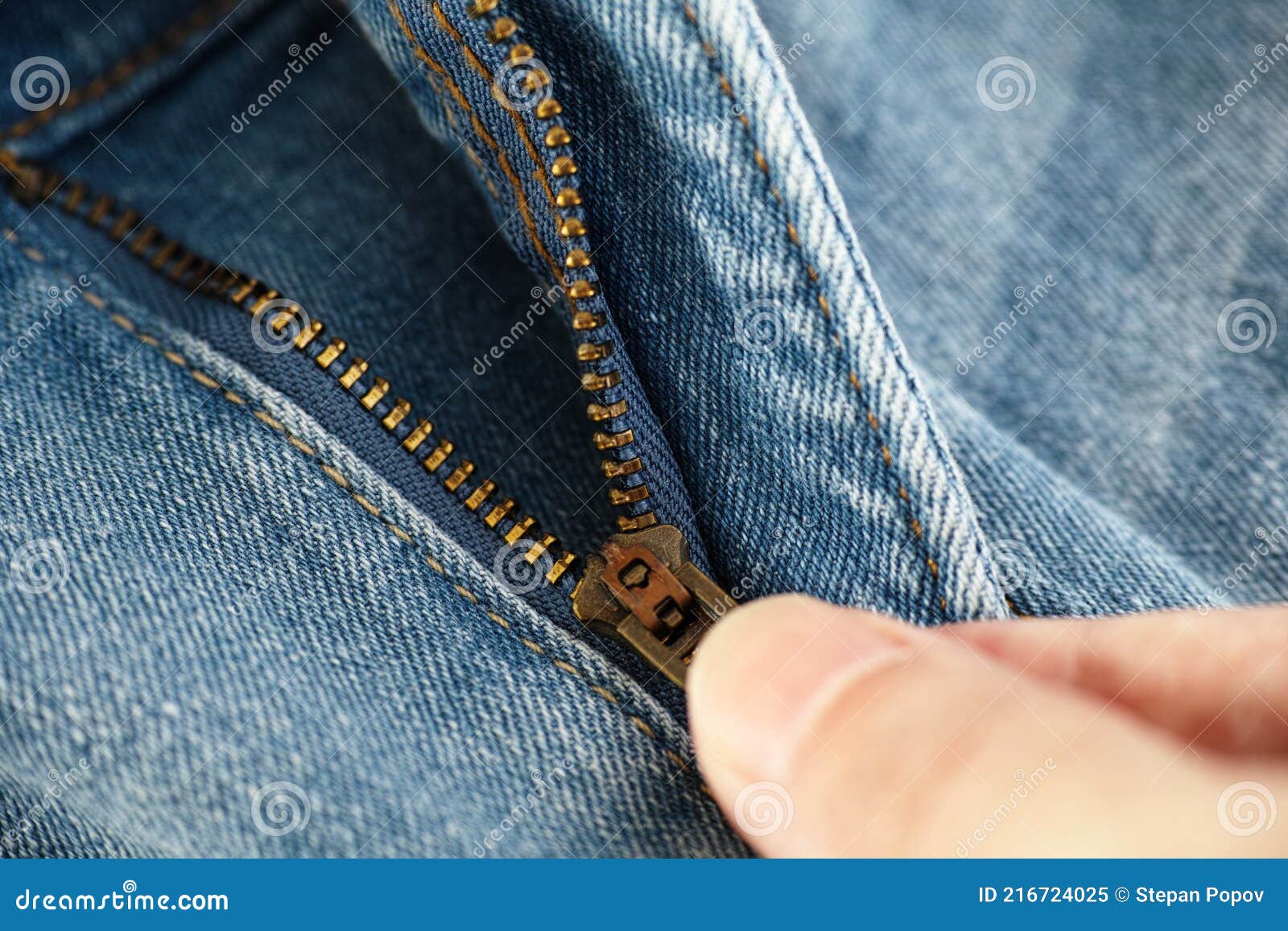 A man unzipping jeans stock image. Image of clothes - 216724025