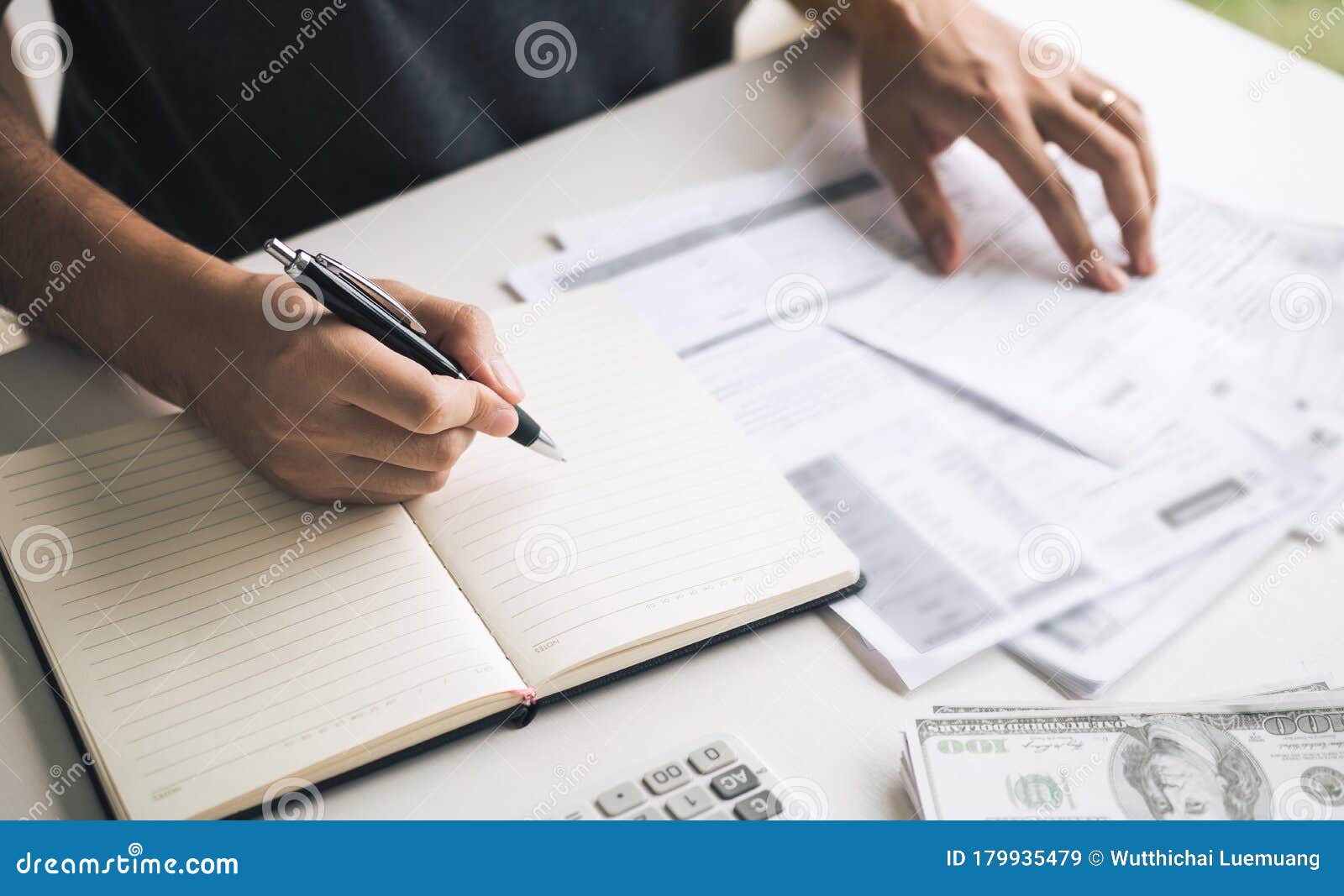 Man Use Calculators and Documents that Calculate Expenses in the Home