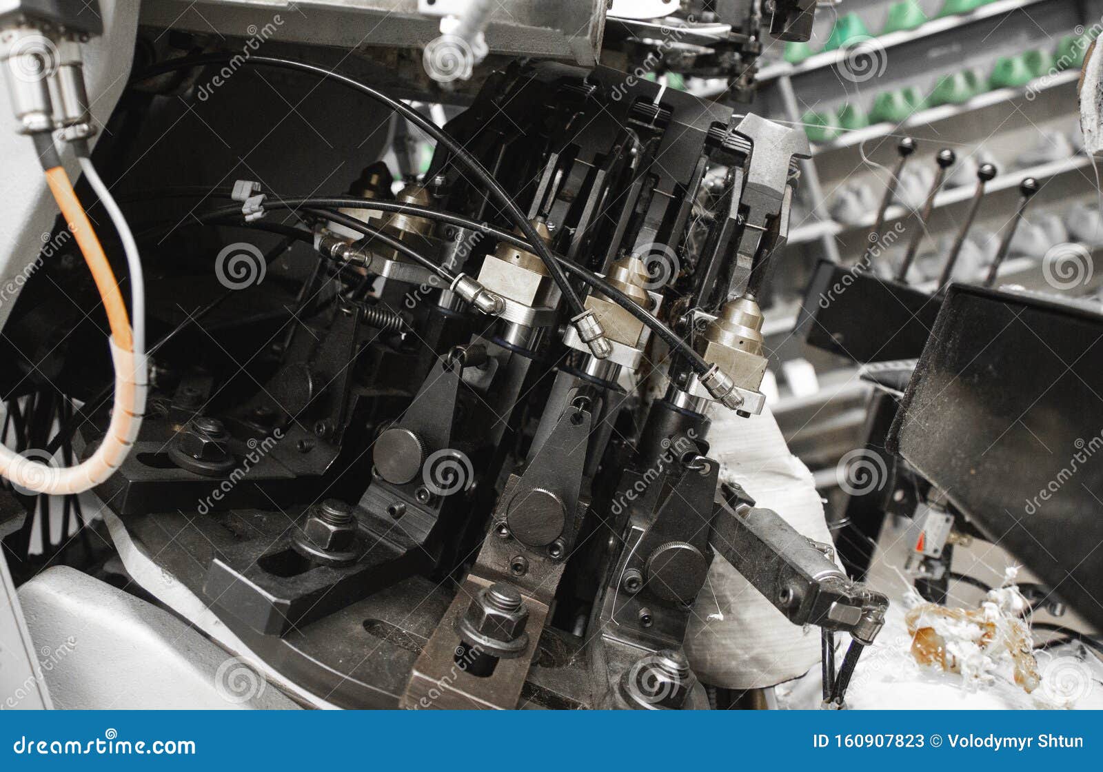 man use special machine tool for making a shoes. the conveyor on a shoes factory with shoe and sole. mass production of