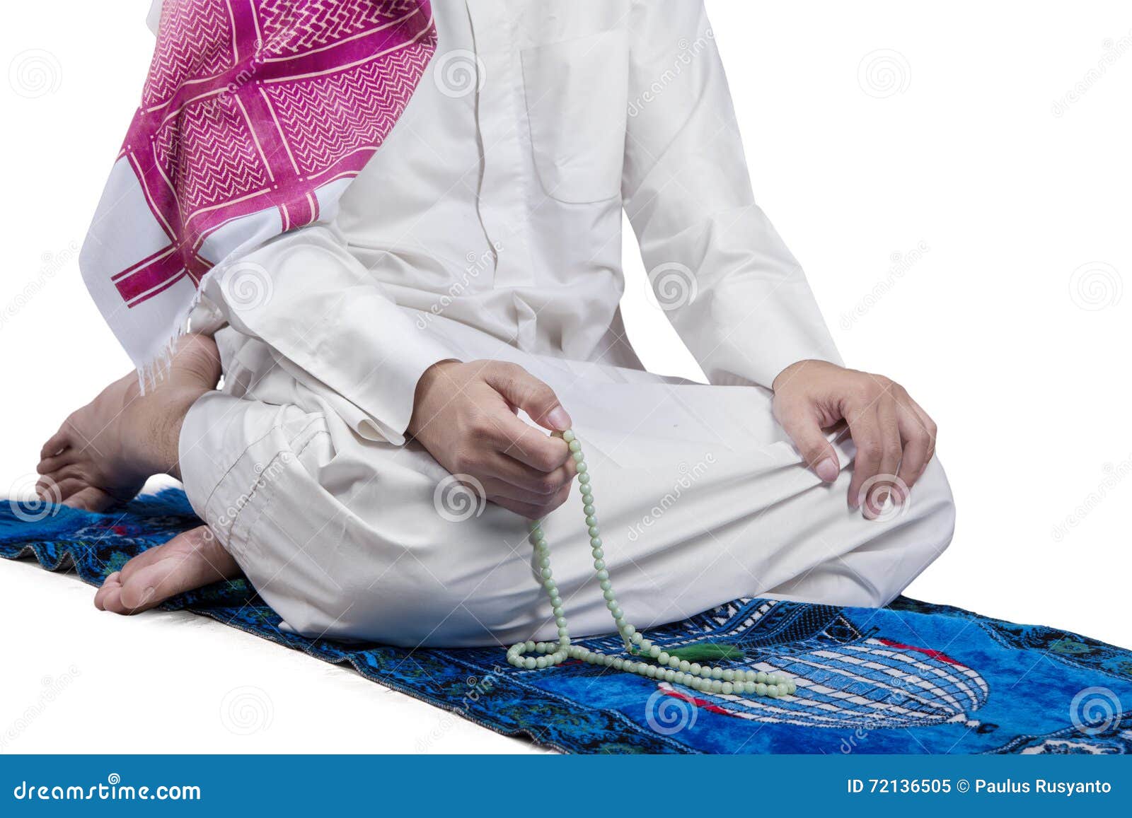 man uses beads to dhikr