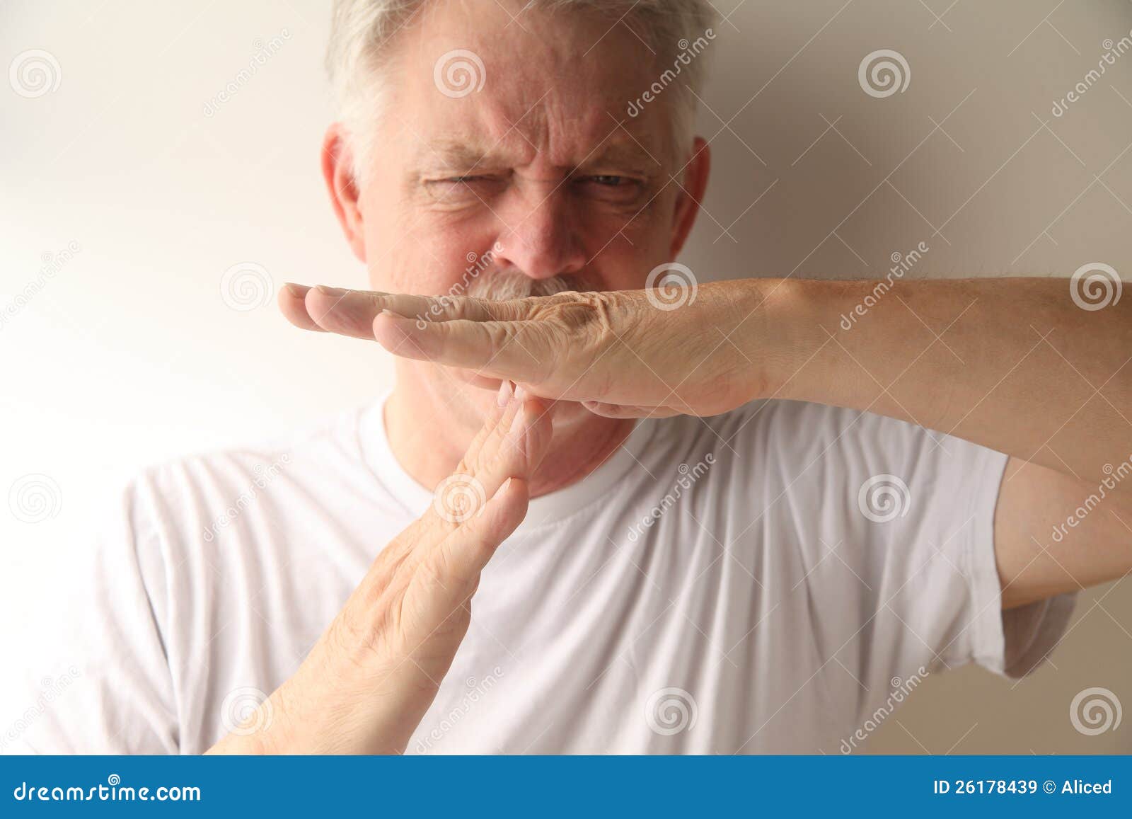 man uses timeout hand signal