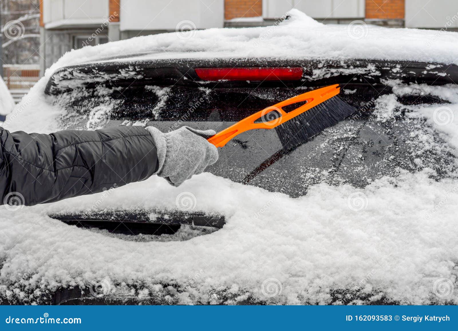 Man Using Brush To Remove Snow from the Car Stock Image Image of