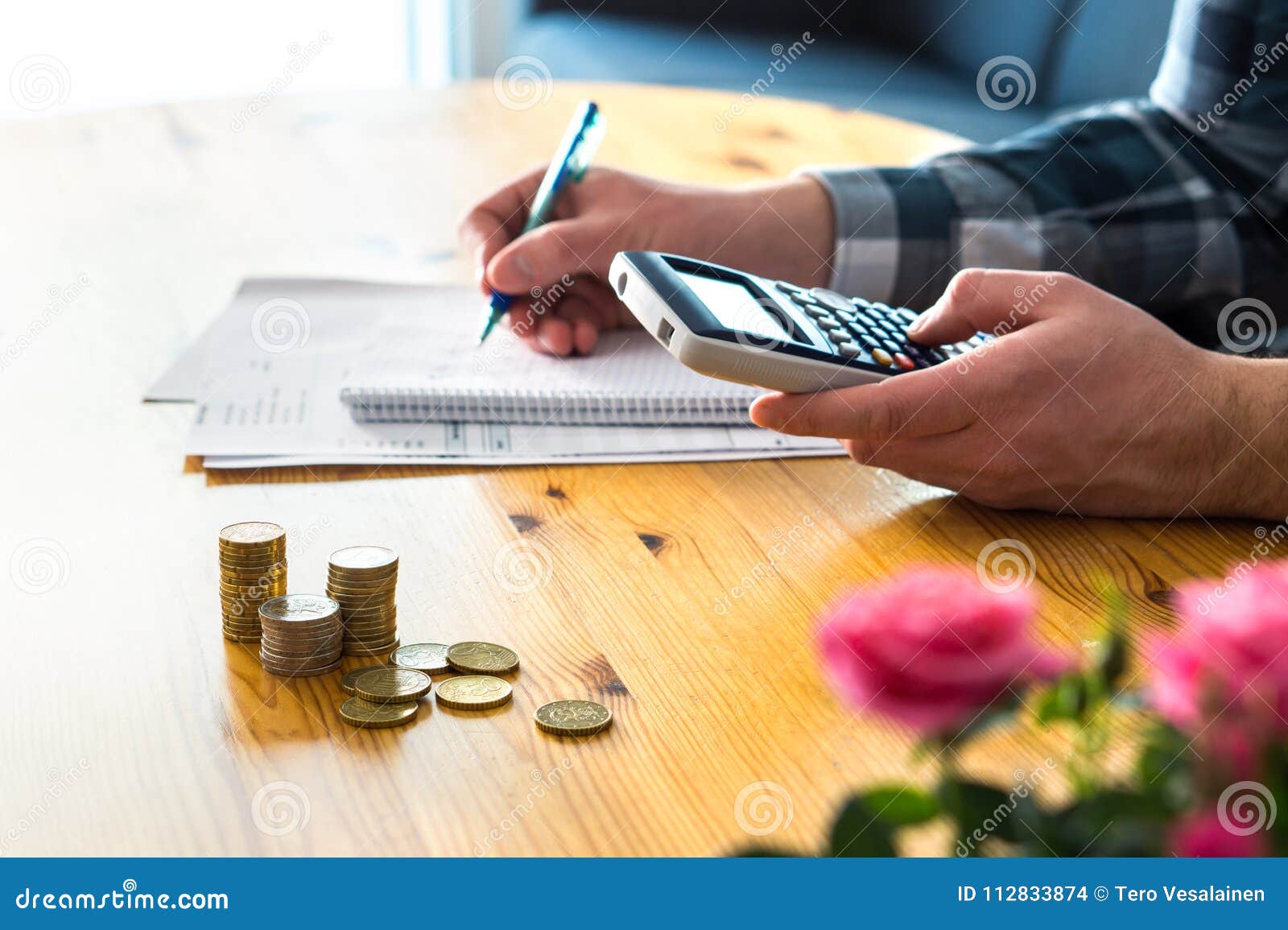 man using calculator and counting budget, expenses and savings.