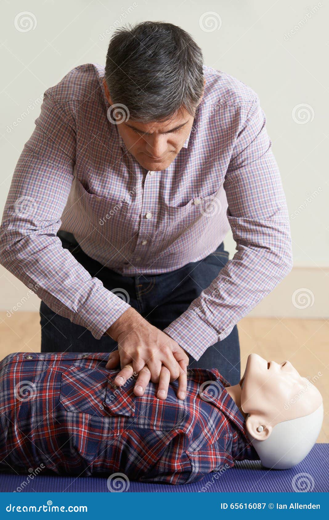 Man Using CPR Technique on Dummy in First Aid Class Stock Image Image