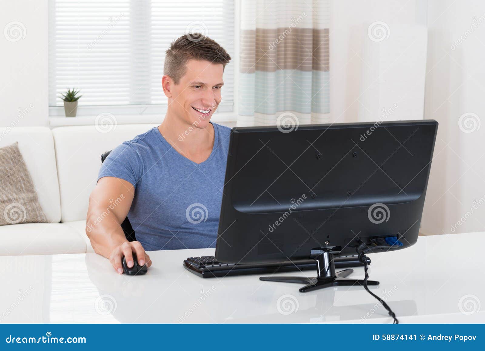 man using desktop computer