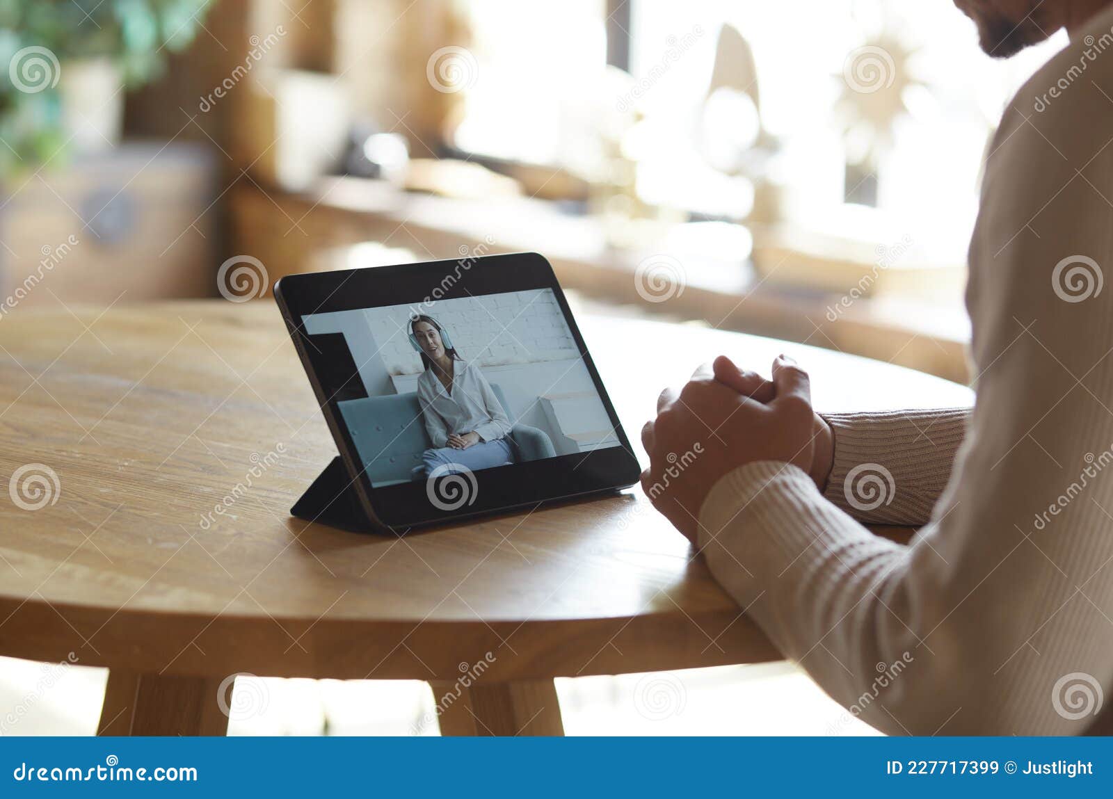 man using digital tablet for video call with friend or coleague