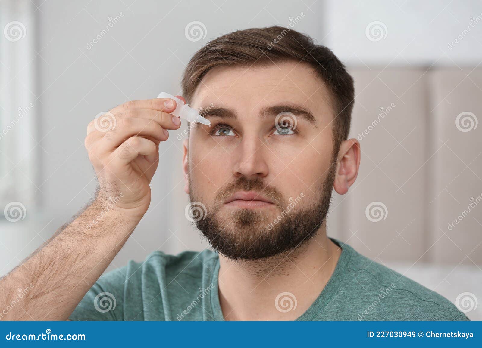Young Man Using Eye Drops on Blurred Background Stock Image Image of