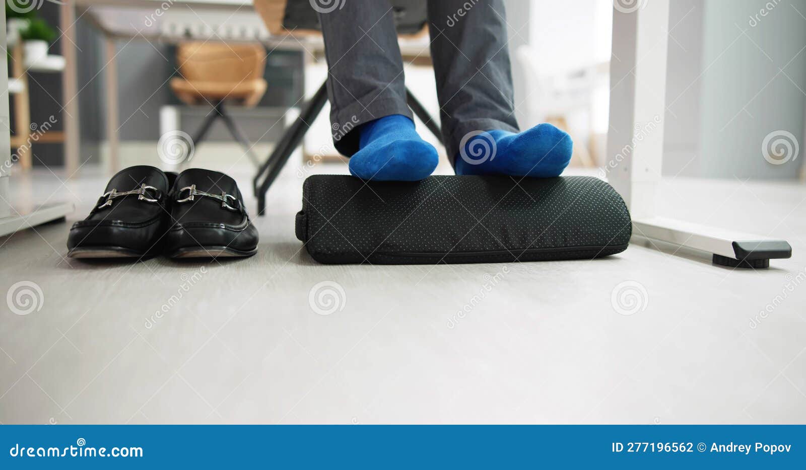 man using footrest to reduce back strain