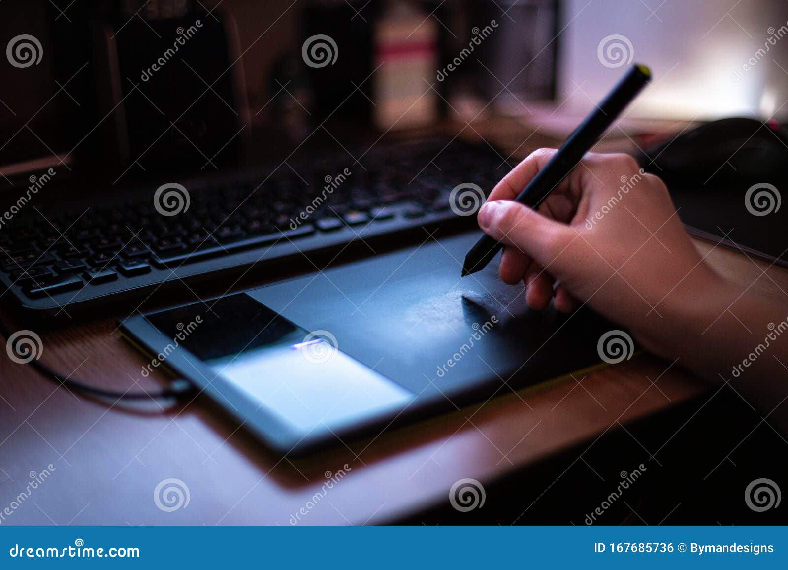 A Man Using Graphic Tablet with Pen Working on New Project Idea Stock