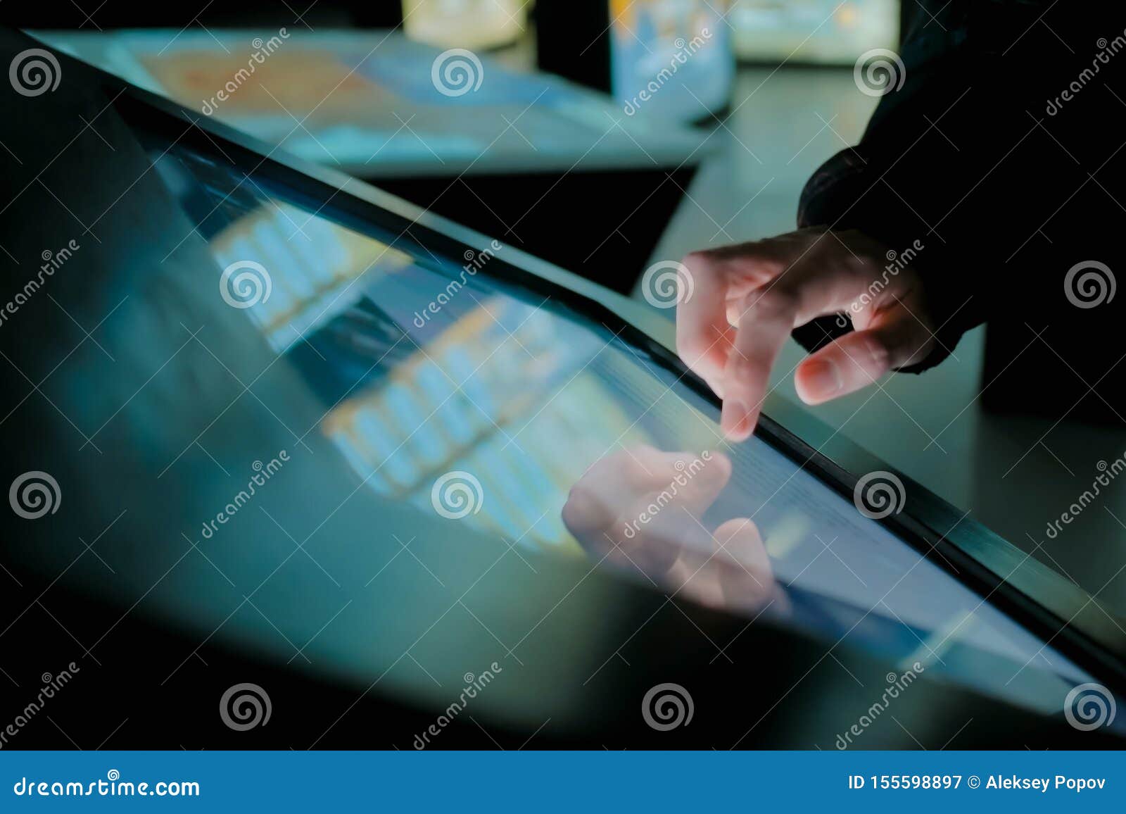 Man Using Interactive Touchscreen Display at Modern History Museum