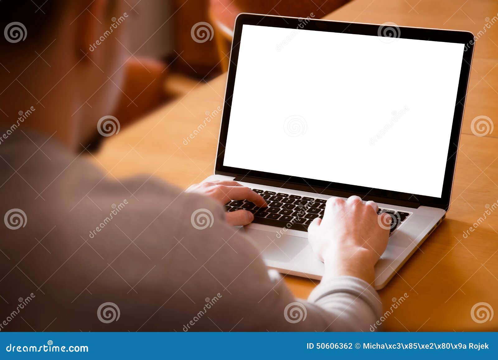 man using laptop computer in living room