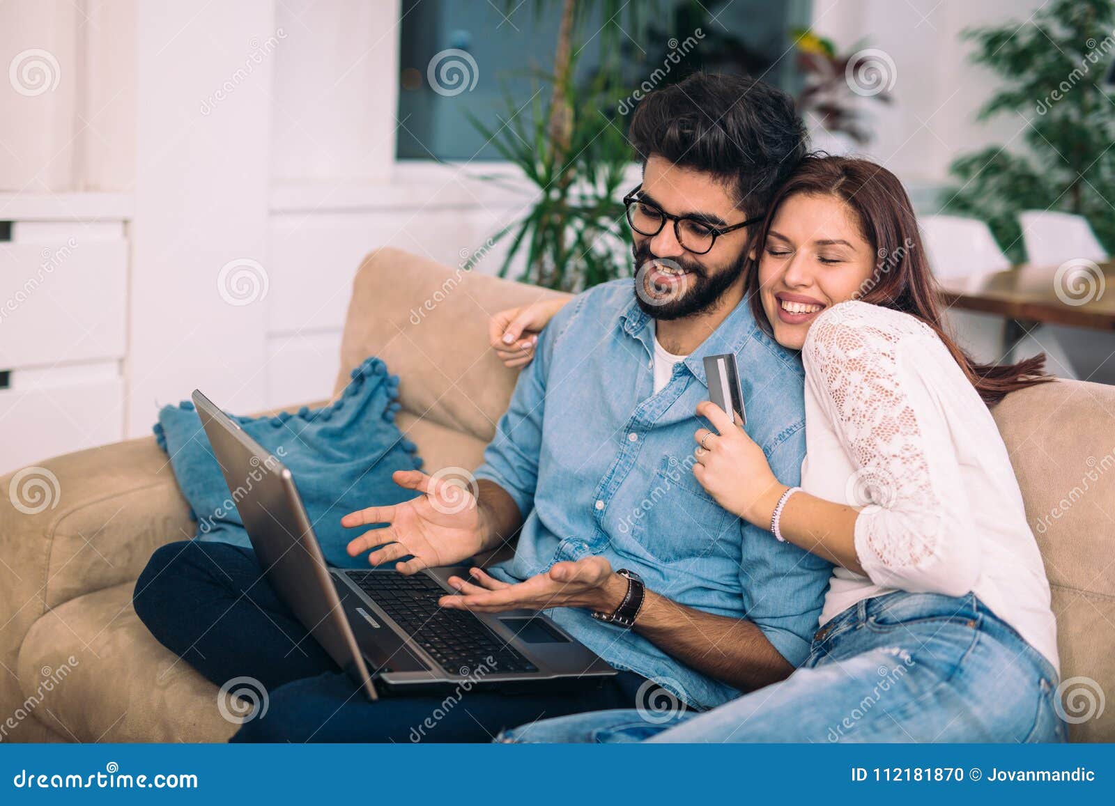 Man Using Laptop And Woman Holding Credit Card. Stock ...