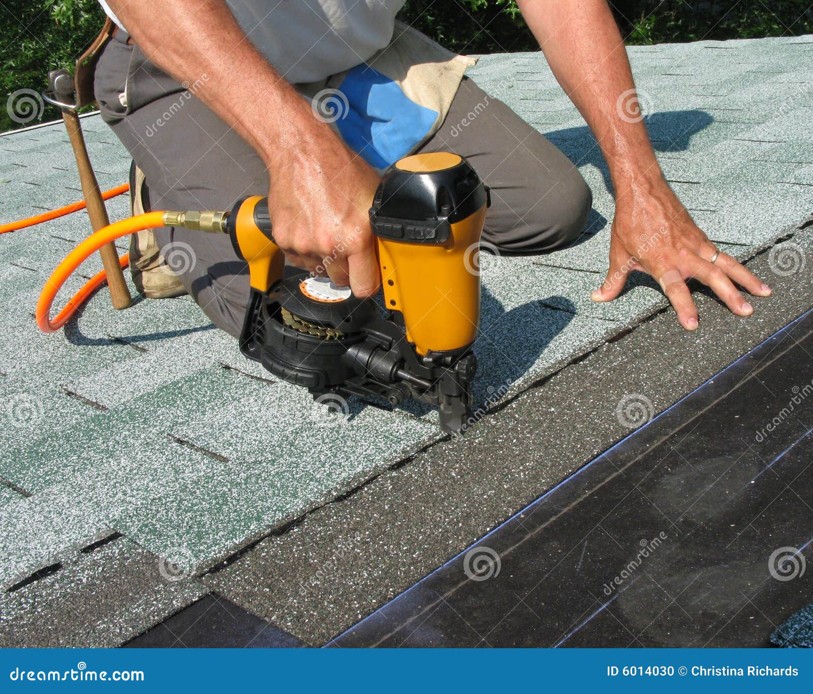 man using nail gun