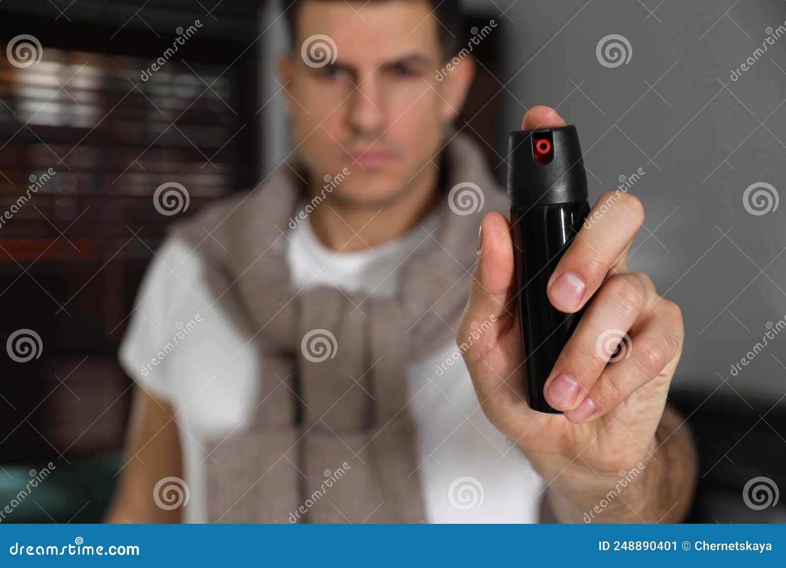 Man Using Pepper Spray Indoors, Focus on Hand Stock Image Image of