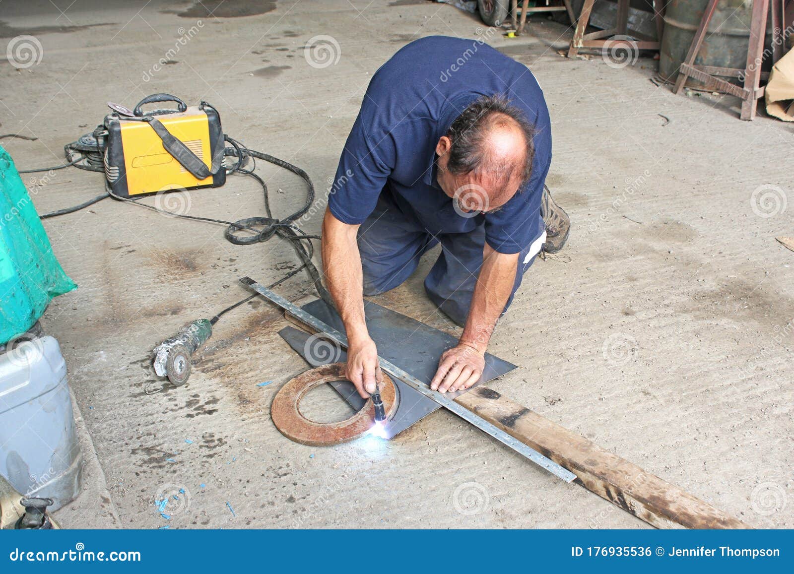 Man using a plasma cutter stock photo. Image of industry 176935536