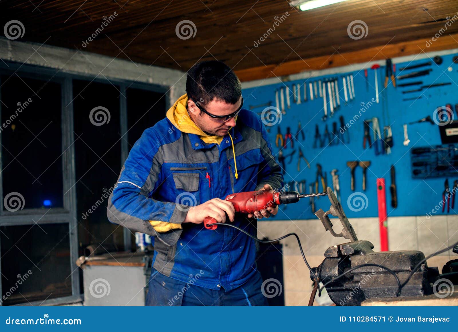 Man Using Power Drill in Stock Image Image of bolt, clothing