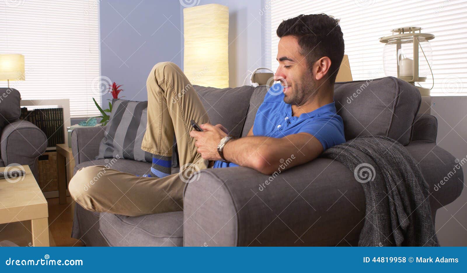 Man Using Smartphone on Couch Stock Photo Image of mobilephone