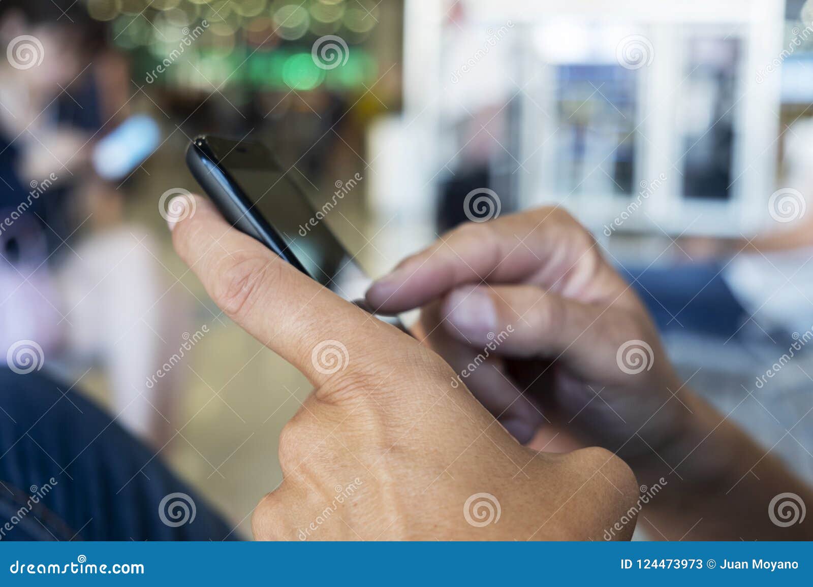 Man Using Smartphone in a Station or Airport Stock Image - Image of ...
