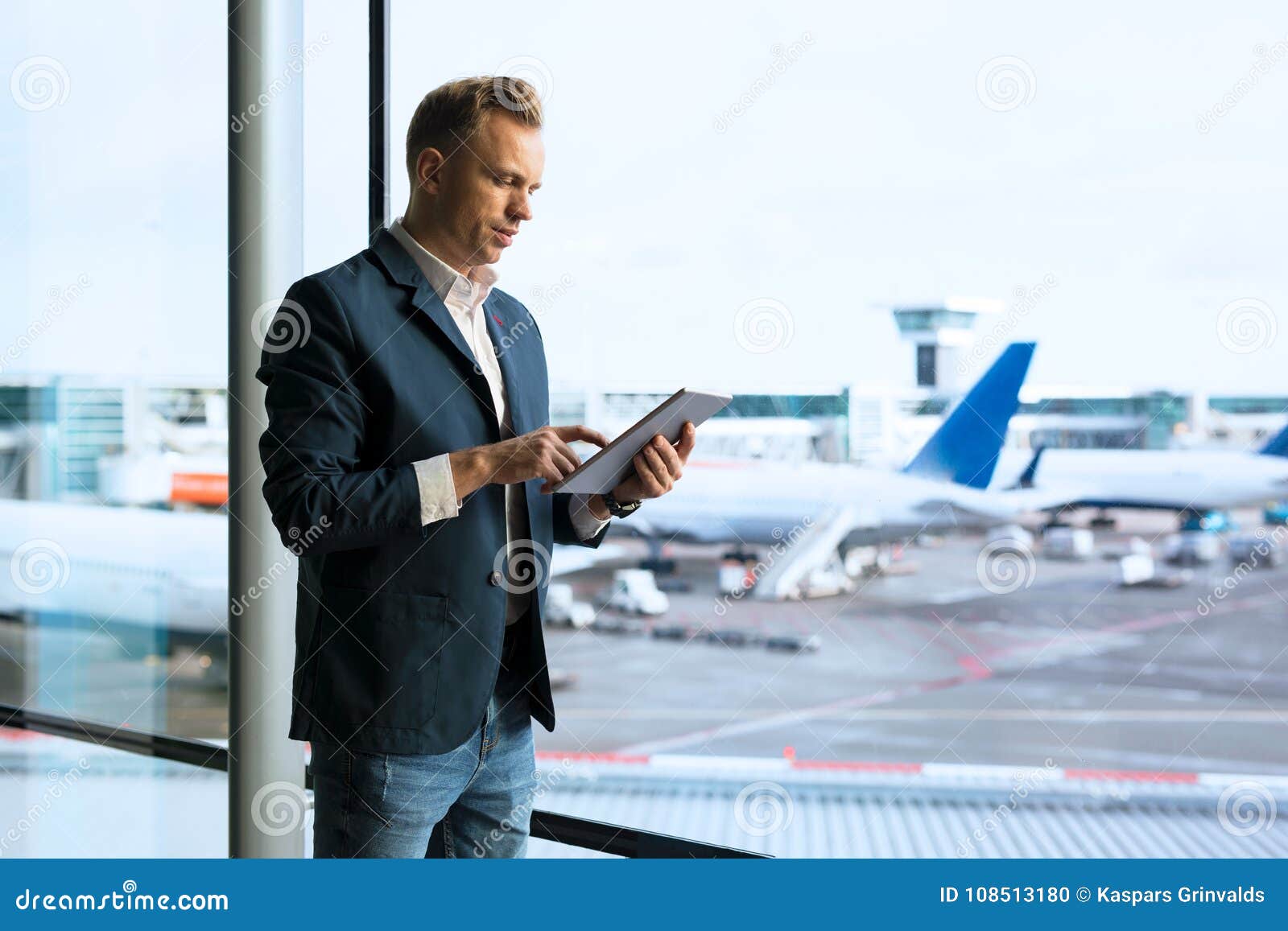 Man Using Tablet in Airport Stock Photo Image of device, people 108513180