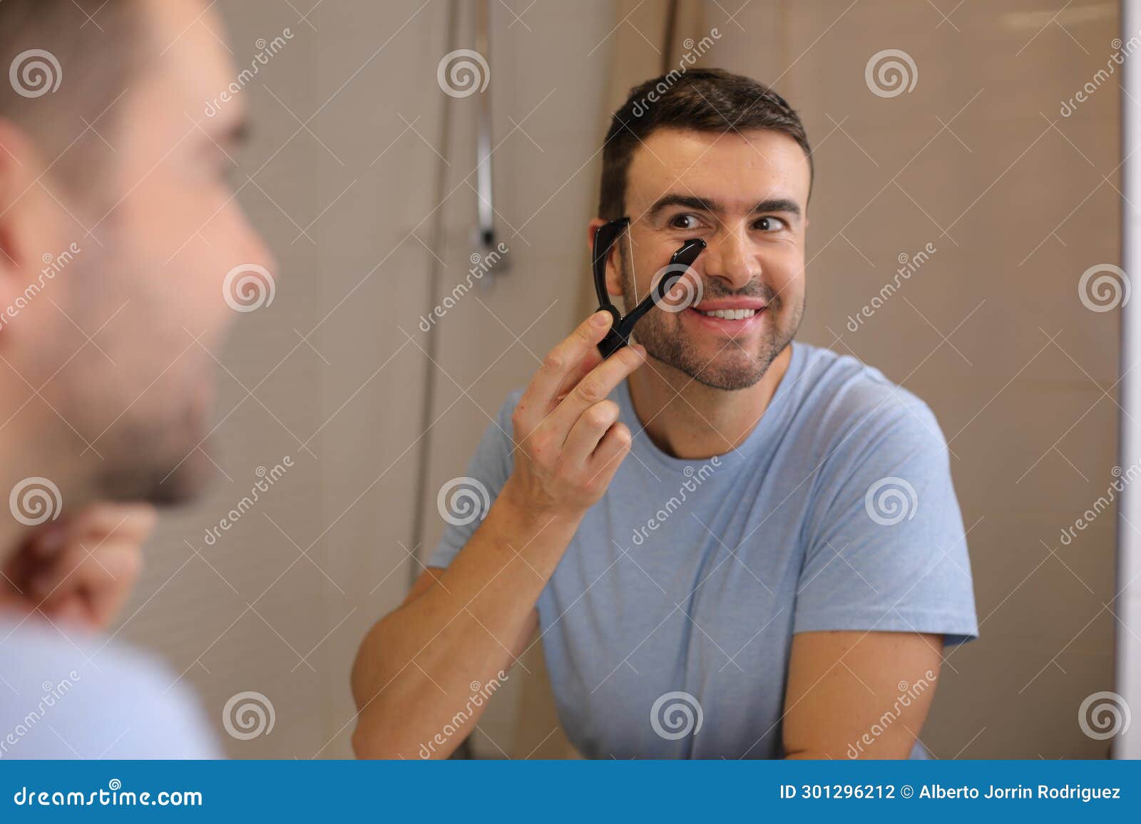 Man Using Threading As a Method for Hair Removal Stock Photo Image of