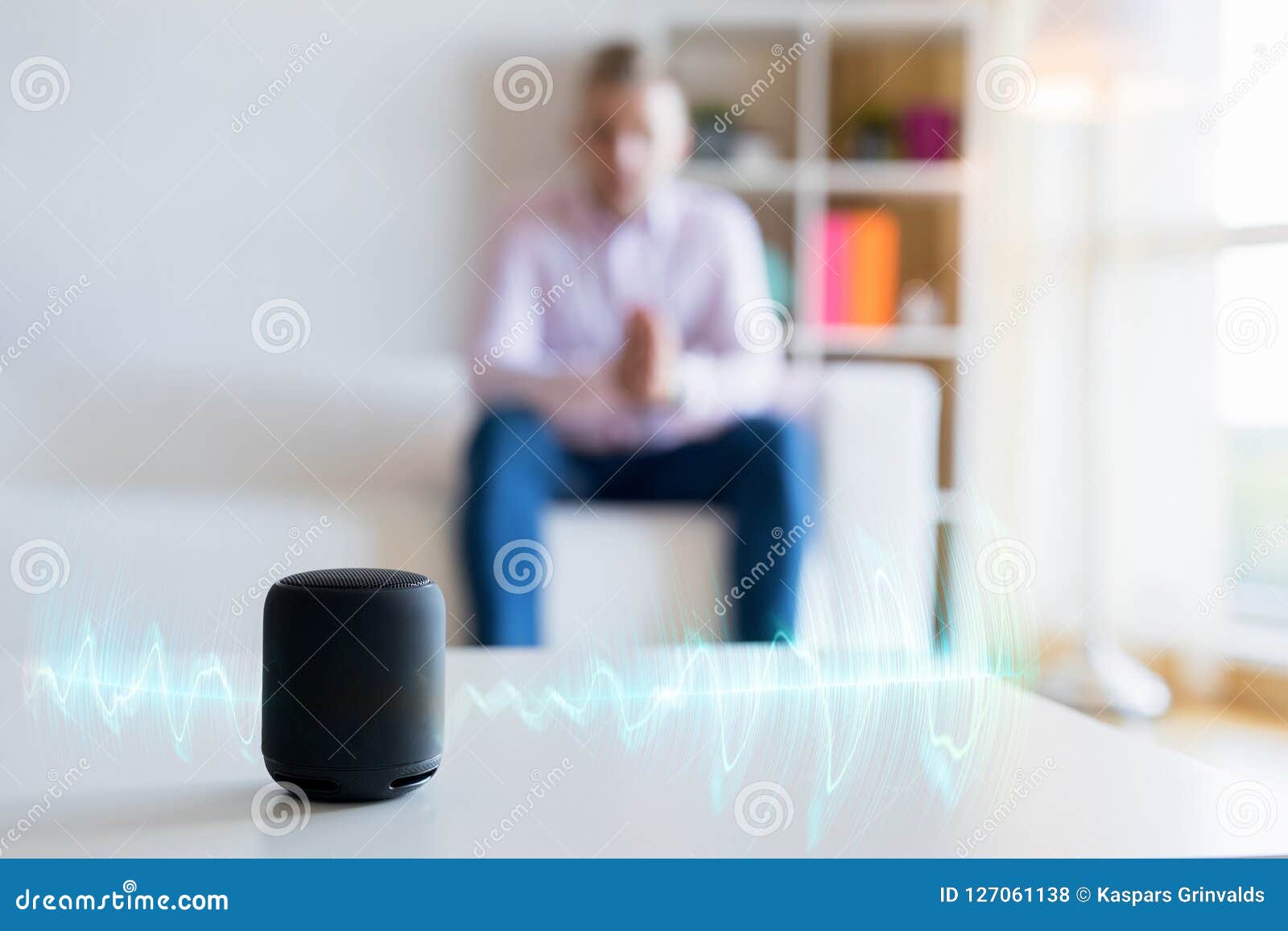 man using virtual assistant, smart speaker at home